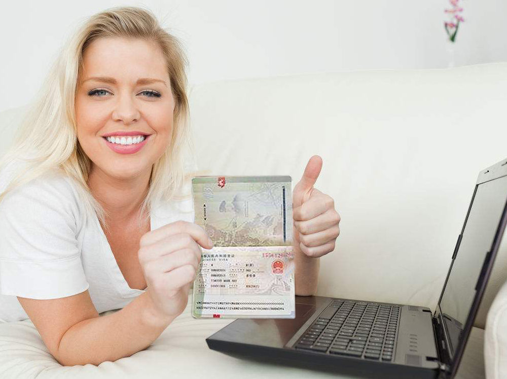 a woman showing a visa page