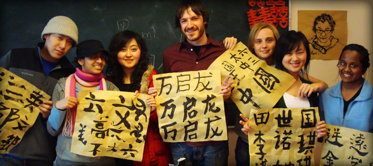 Foreign students taking photos with their Calligrapy works in their hands in China